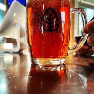 a glass of beer on a table