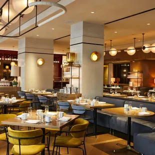 a dining area with tables and chairs