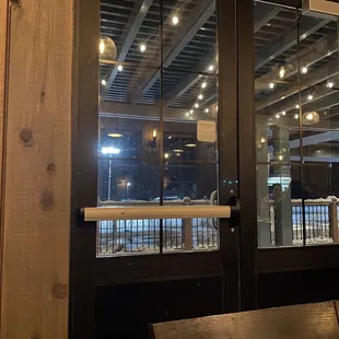 a view of a restaurant through a glass door