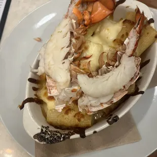 Over cooked lobster with reheated rigatoni Mac and cheese