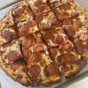 a pepperoni pizza in a box