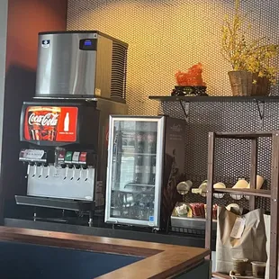 a counter with a soda machine