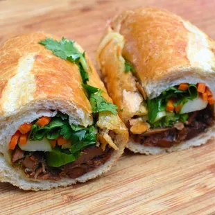 a sandwich cut in half on a cutting board