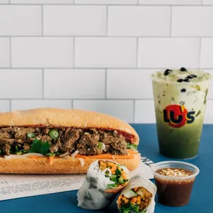 Banh MI Sandwich, Pork and Shrimp springrolls, and a cup of delicious Green Tea Latte