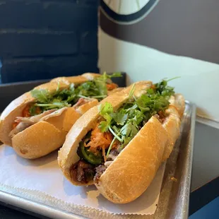 two sandwiches on a tray