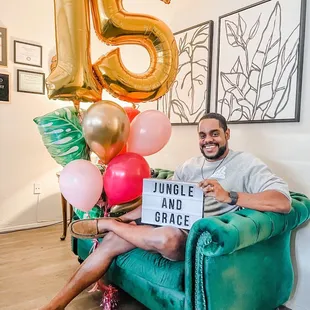 One of the owners delivered it to me and took a pose on my couch. Such fun!