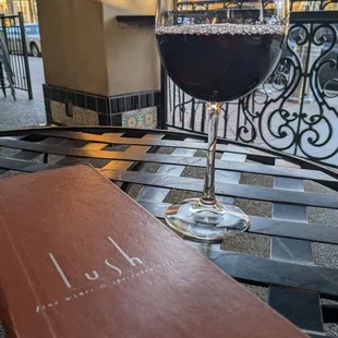 a glass of wine on a table