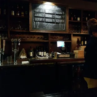 a woman behind the bar