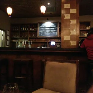 a woman sitting at a bar