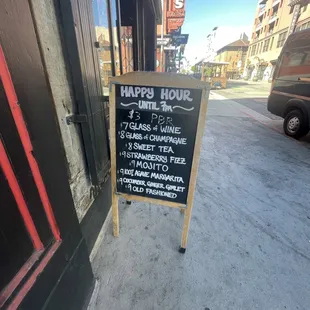 a sign for a happy hour