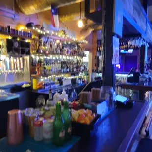 a bar with a variety of drinks