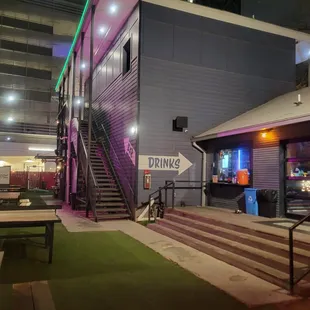 the front of a building with stairs leading up to it