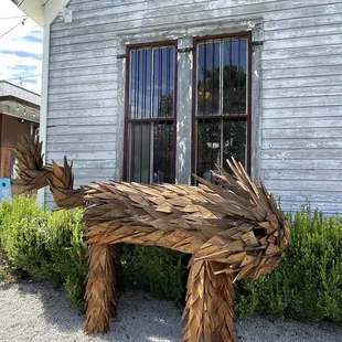 a wooden bench made out of branches