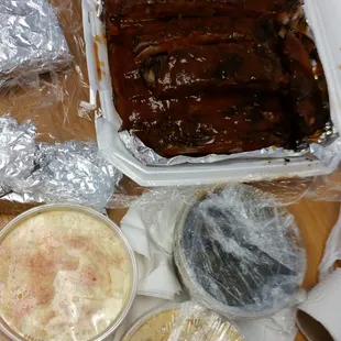 Ribs, collards greens, corn bread,mac and cheese and potato salad.