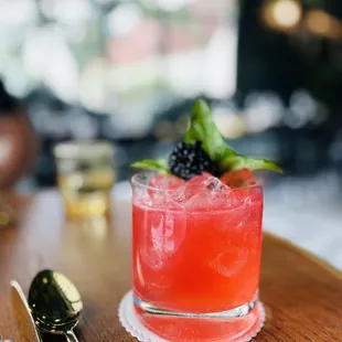 Indigo Kick: Vanilla Infused Ketel One, Blackberry Basil Shrub, Local Honey, Lemon, Ginger Beer