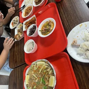 Two three entree dishes and Pancit