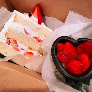a slice of cake and strawberries