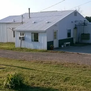 a white building with a sign in front of it