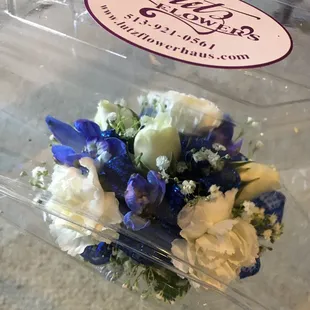 Two of the corsage choices, all sweetheart roses with blue delphiniums OR mini-carnation &amp; sweetheart rose mixture with blue delphiniums.