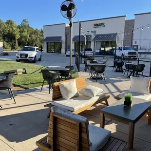 outdoor seating area with tables and chairs