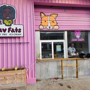 a purple building with a sign that says luv fats dairy free ice cream