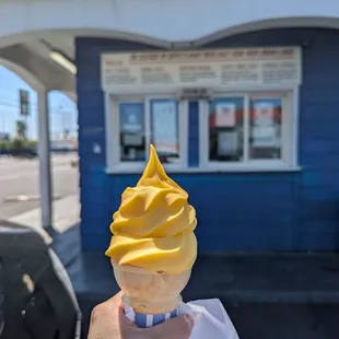 $2.98 Mango Whip (dairy-free) on a flat cone.