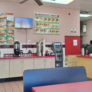Cofee &amp; Tea Station with Menu board of sandwiches offered.