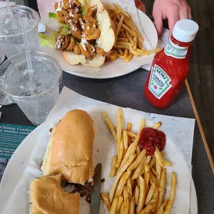 a plate of french fries and a sandwich