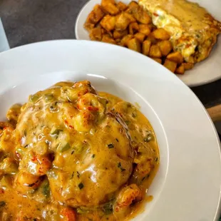 Cajun biscuit special (delicious, must order) and the crawfish omelet (could use more sauce) with perfectly crispy and seasoned potatoes.