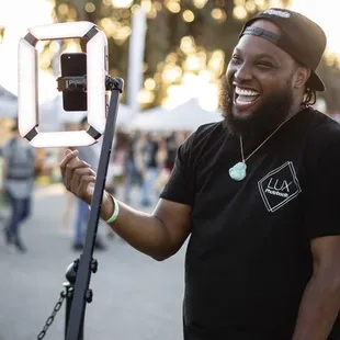 Team member Phil smiling and having a great time at the Asparagus Festival in Stockton!