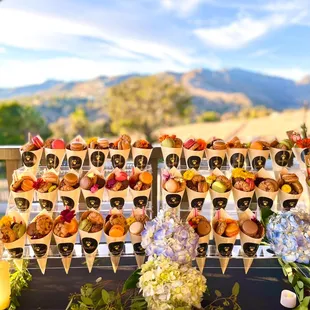 A beautiful charcuterie and dessert cone display for the Grand Opening of the beautiful pilates studio in Malibu!