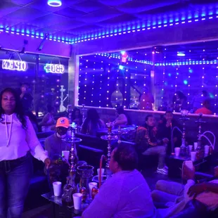 a woman walking through the lounge