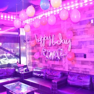 a couch and balloons