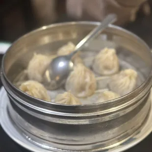 A1. Juicy Pork Steamed Dumplings