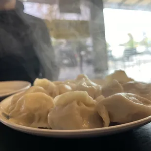 a plate of dumplings on a table