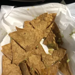 Leftover after the small amount of guacamole was eaten with 6 chips and burnt tortilla chips