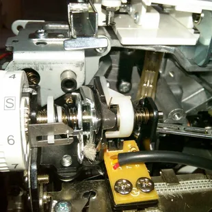 Singer tension assembly