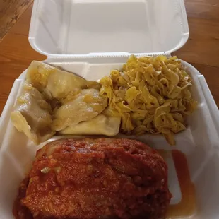 Giant stuffed cabbage, buttered noodles, and homemade potato and cheese pierogies with sauteed onions in butter.