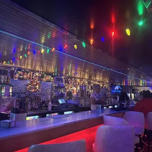 a bar with colorful lights