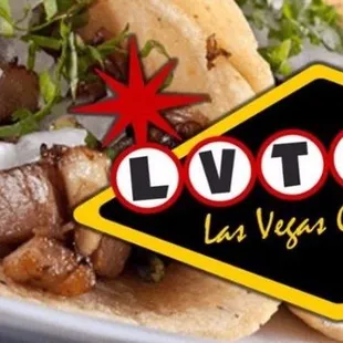 a plate of tacos and lime wedges
