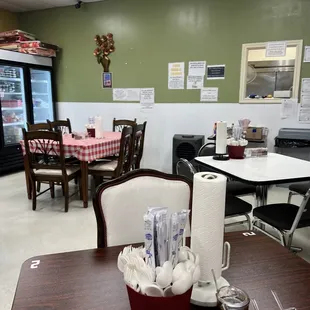 tables, chairs, and a refrigerator