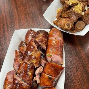 a plate of ribs and meat