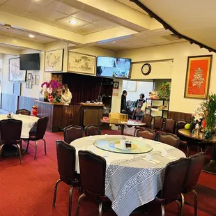 a dining room with tables and chairs