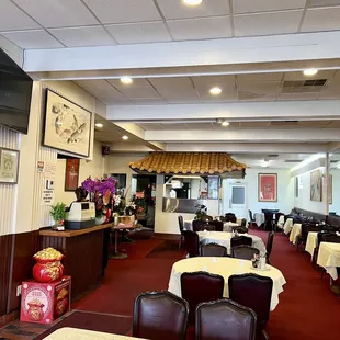 a restaurant with tables and chairs