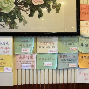 a bunch of sticky notes on the wall