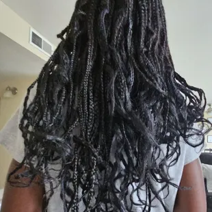 4 days old! Curls fell out on day 2! The hair is uneven.  Her real hair is coming out of the braids.