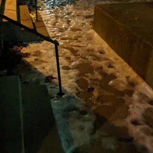Unsalted sidewalks covered in slick ice