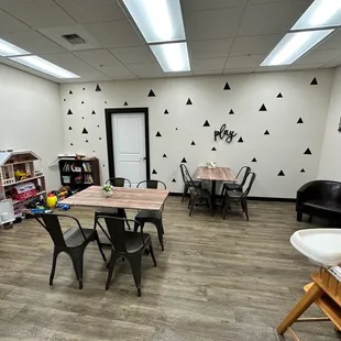 a dining area with tables and chairs