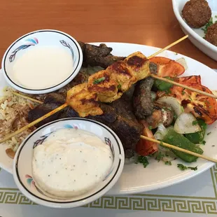 Mediterranean Combination Platter with Beef Kafta, Shish Kabob, Shish Tawook, and Lamb served with rice and sautéed vegetables
