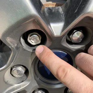 One of several damaged lug nuts.